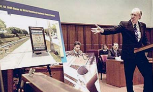 Image of attorney presenting evidence at trial